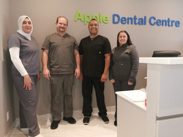 A Dental Hygenist cleaning a patients teeth at Apple Dental Centre